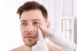 Dermatologist examining a patient's skin in clinic, representing Mohs surgery for effective skin cancer removal with cosmetic preservation